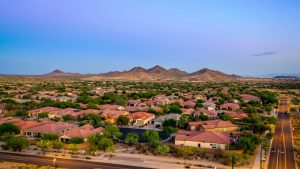 Aerial view of a community in Arizona during the golden hour at sunset.