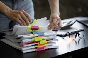 Woman hands going through the paperwork