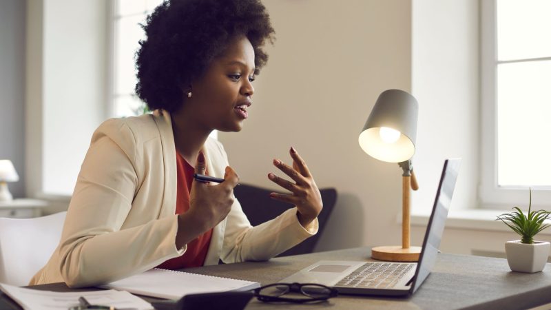 Woman virtually attending the African American Conference