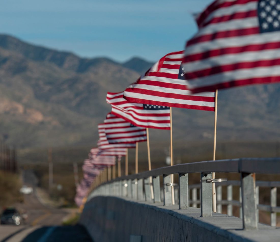 American flags line a bridge in rural Arizona