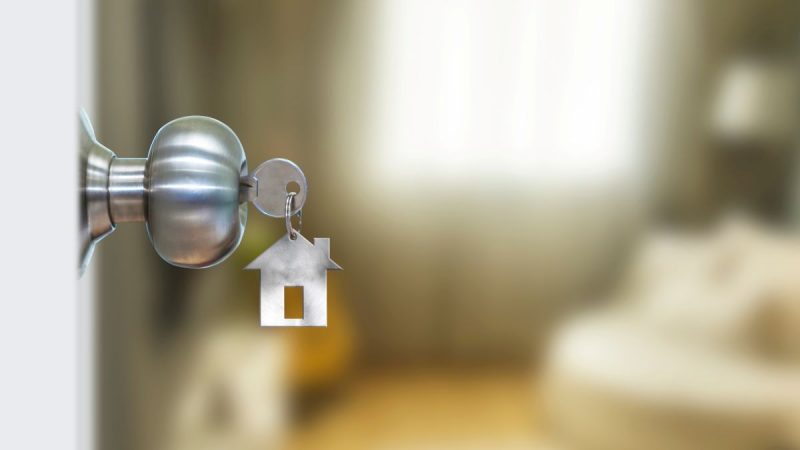 Front door with keys in the door knob.