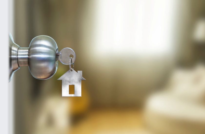 Front door with keys in the door knob.