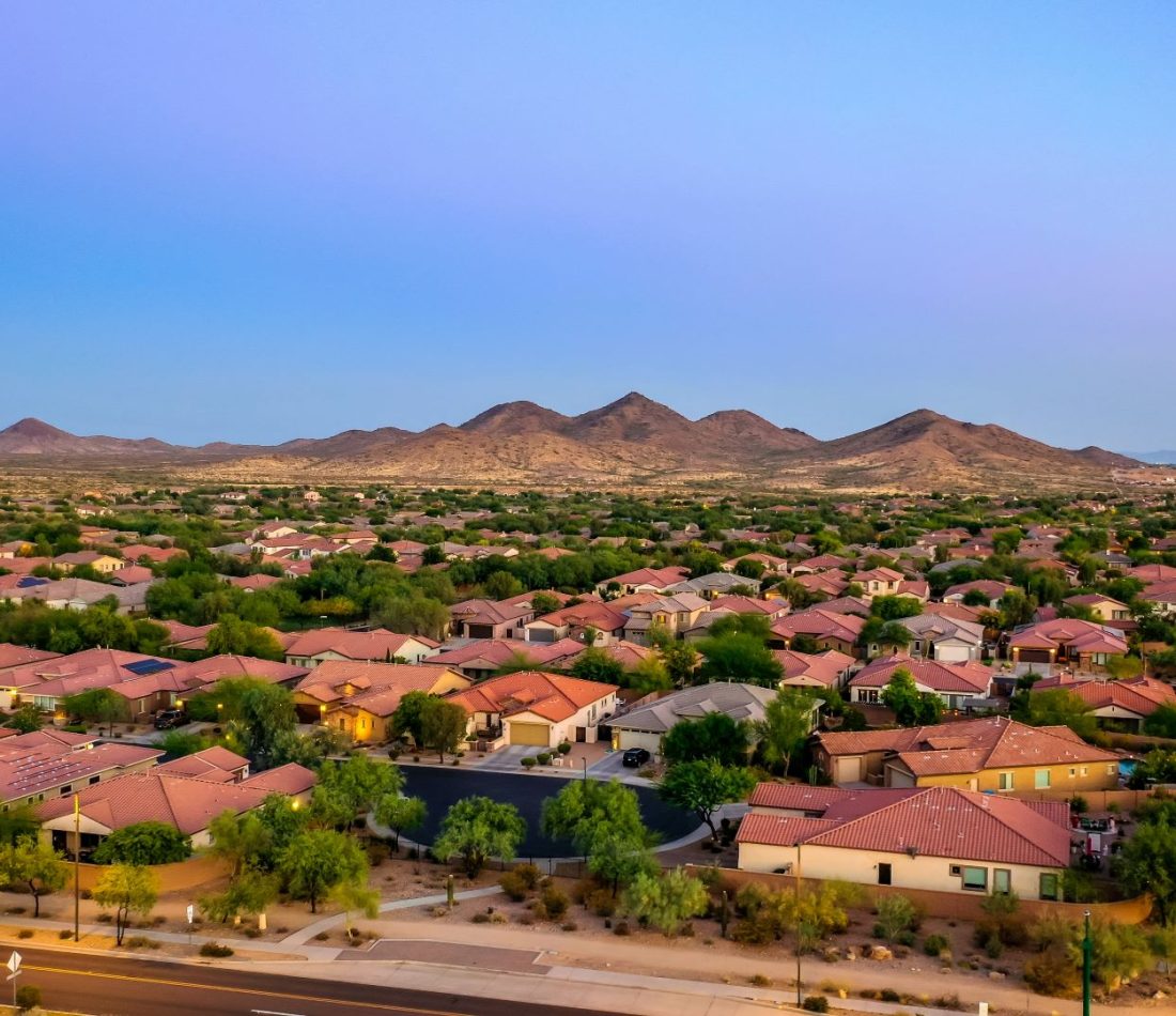 Aerial view of a community in Arizona during the golden hour at sunset.